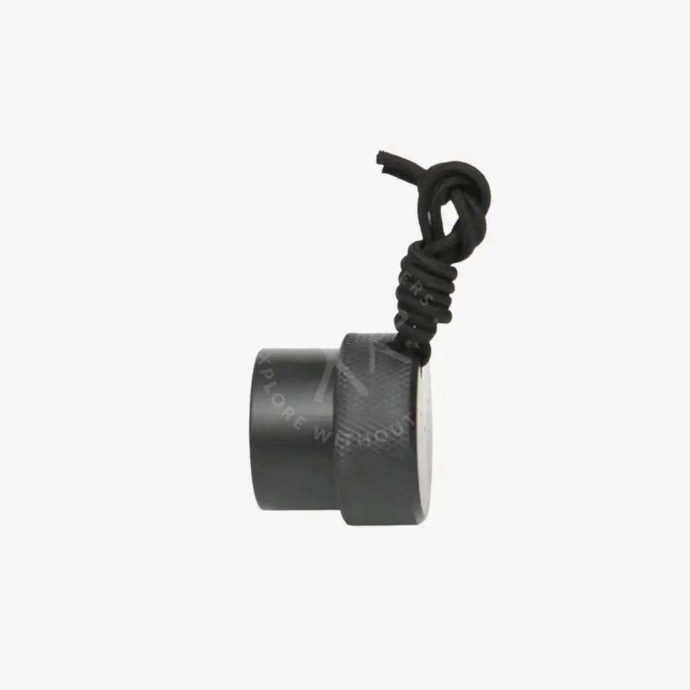 Black cylindrical device with textured grip and coiled black cable on a white background
