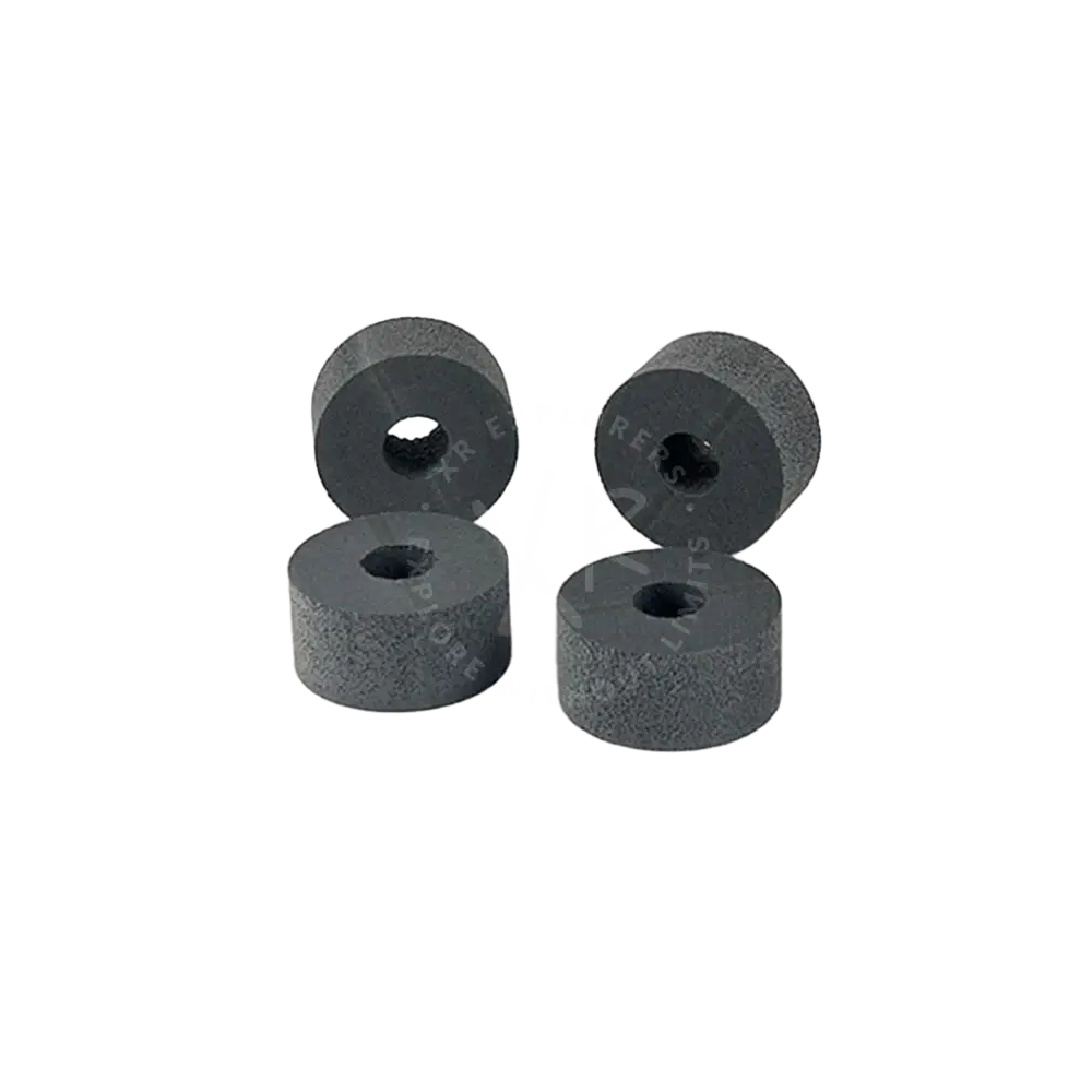 Four dark gray cylindrical foam pads with textured surface and central holes for floating ring 125g