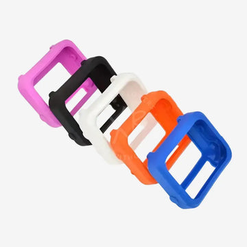 A collection of silicone protective covers for Shearwater dive computers, displayed in black, purple, white, orange, and blue colors.