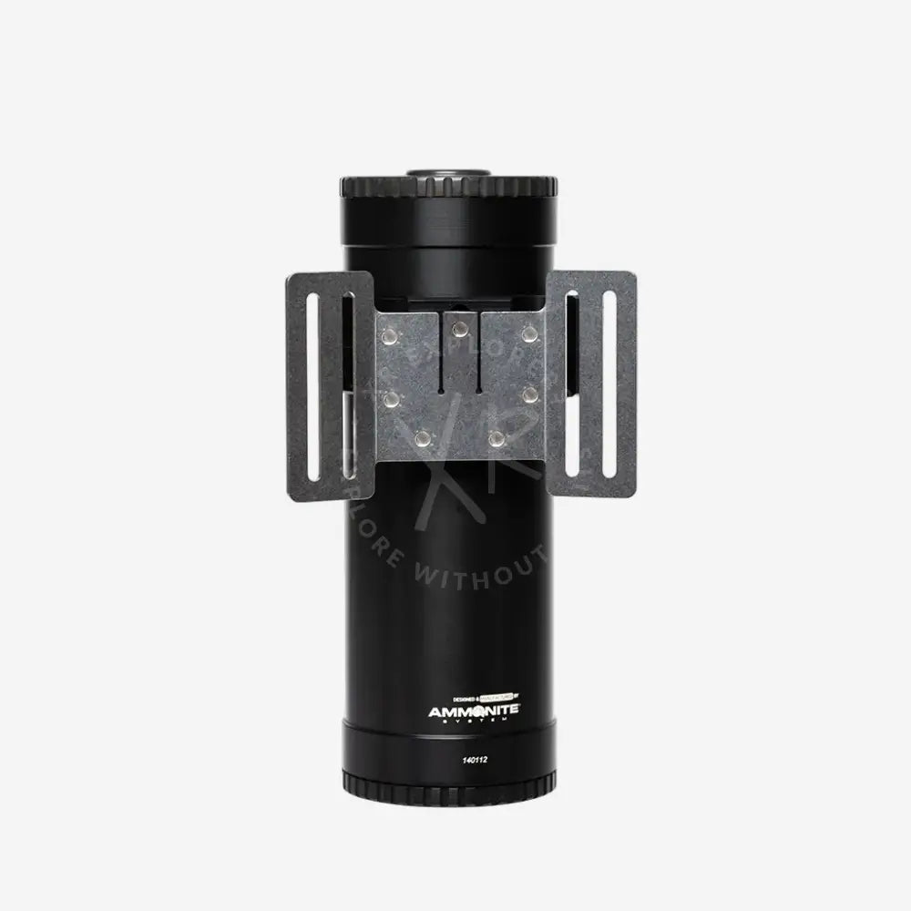 Black cylindrical device with a metal bracket on a white background