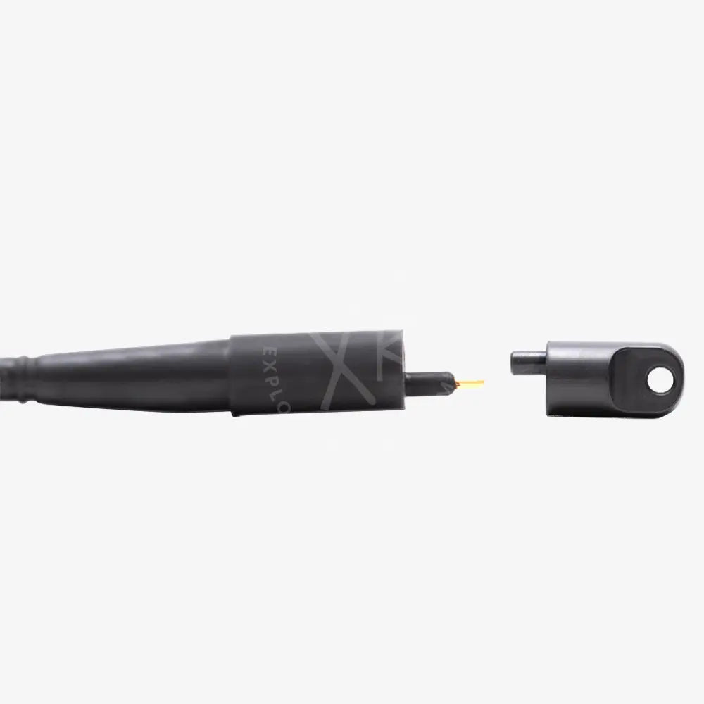Black cylindrical blind plug for e o cord with metallic tip and cap featuring a sleek matte finish