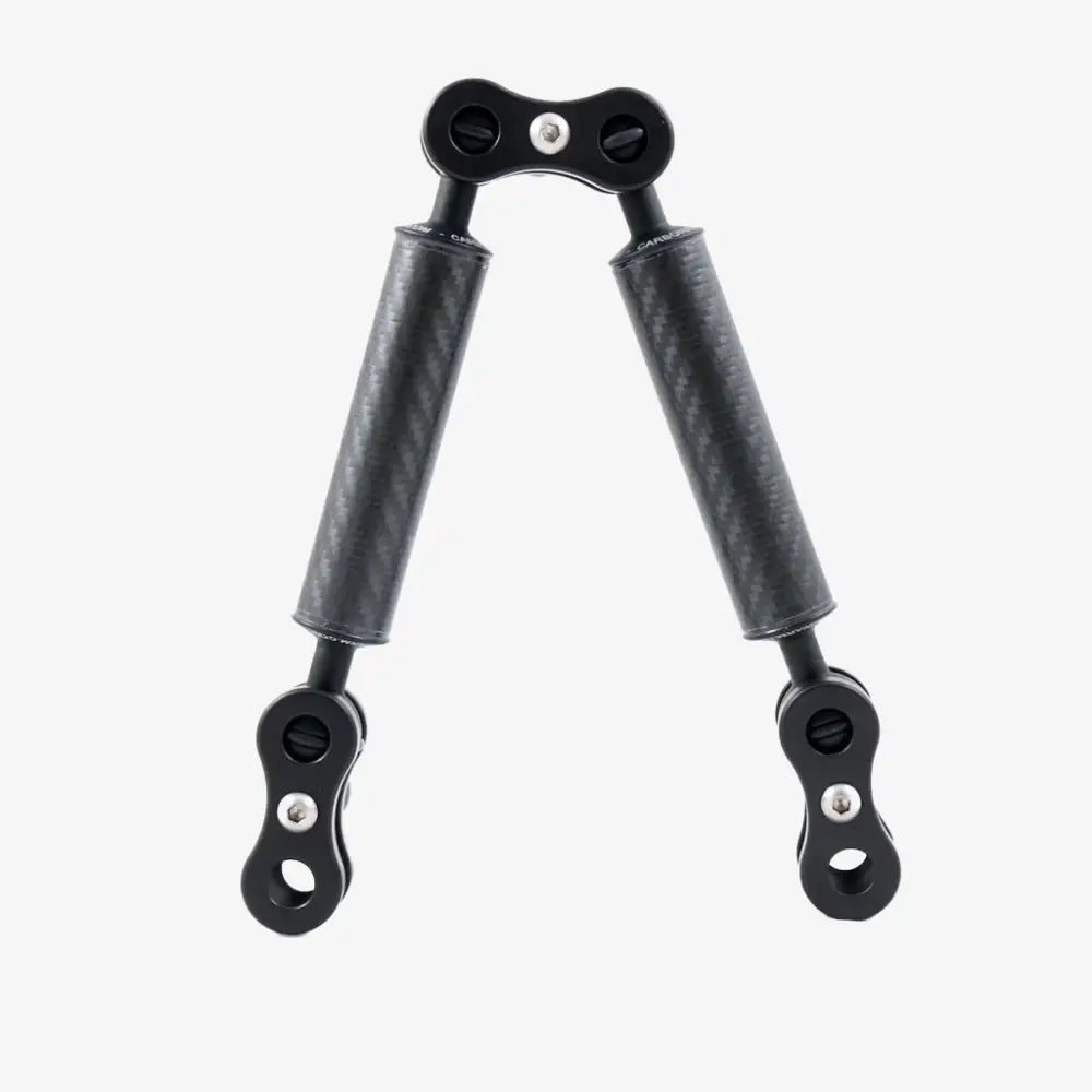 Black carbon fiber handlebar grip extender with metallic hardware from carbon arm standard kits visible from back side