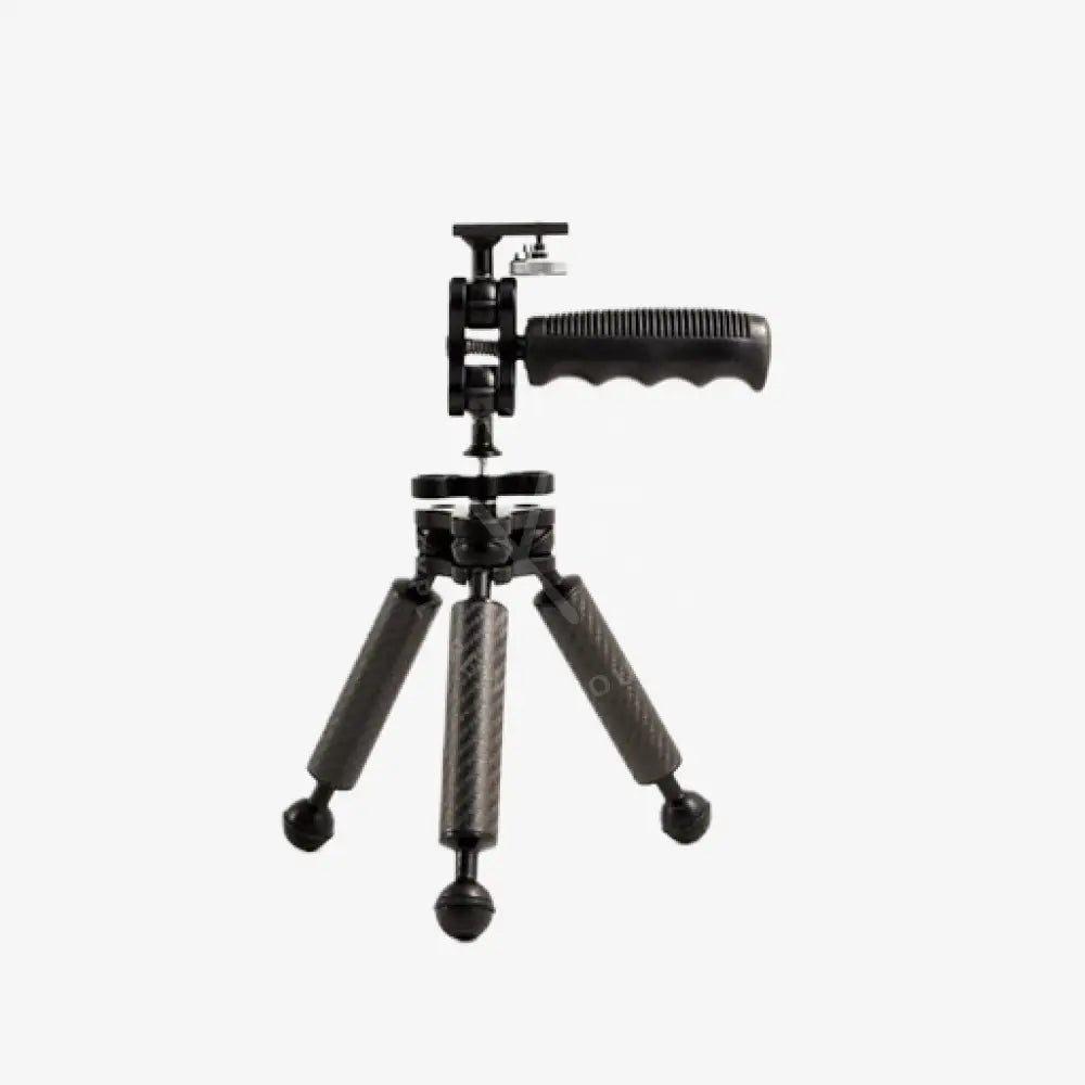 Black carbon arm tripod with handle and ball head featuring textured grip surfaces on legs for stable support