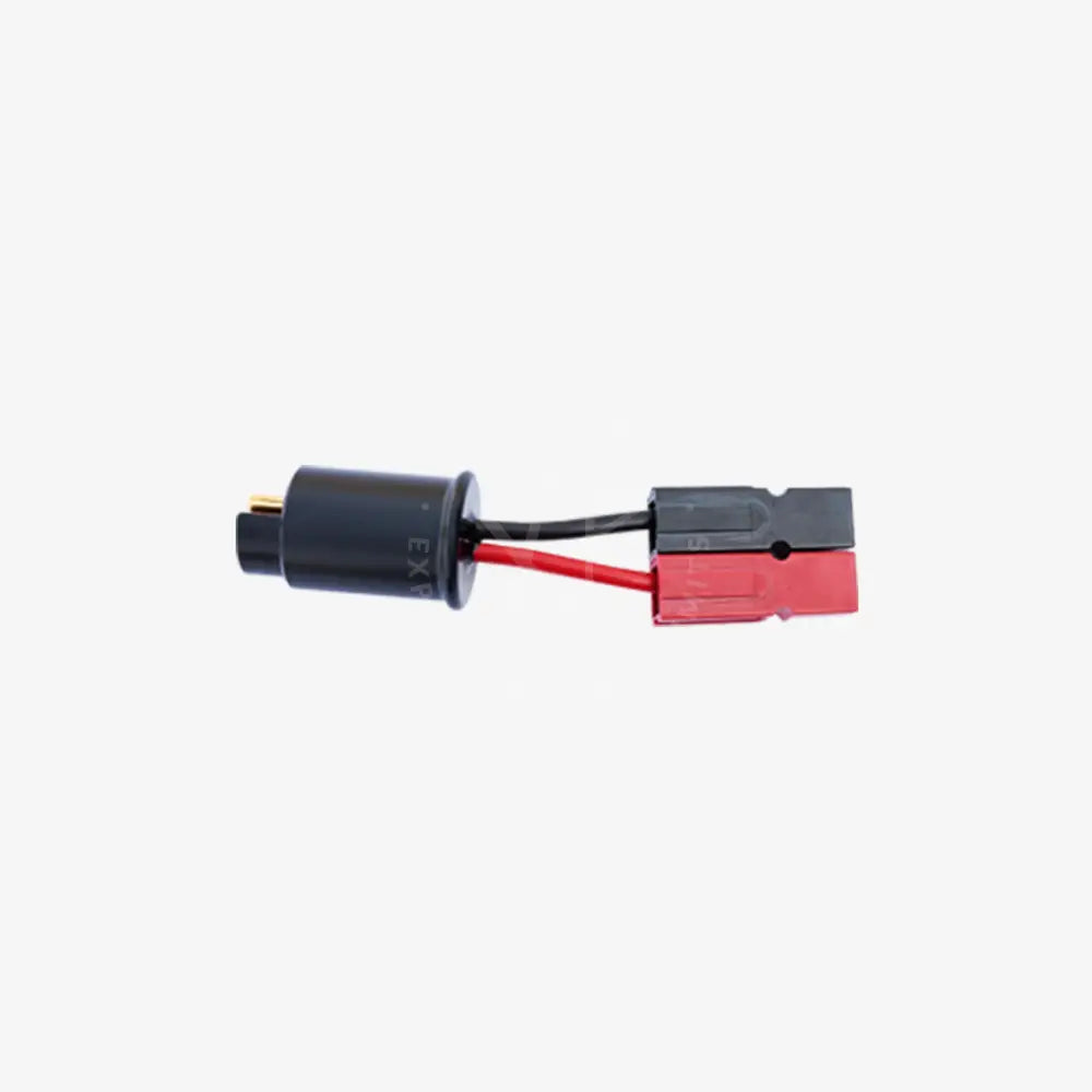 Black and red charging adapter with cylindrical housing and rectangular plug connected by insulated wires