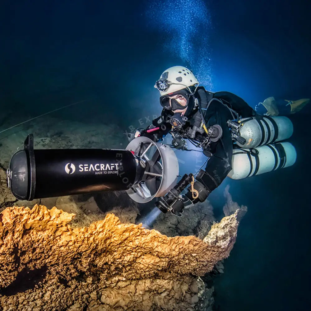 Black and silver seacraft discover dir diving underwater exploration device with cylindrical body and white fan attachment