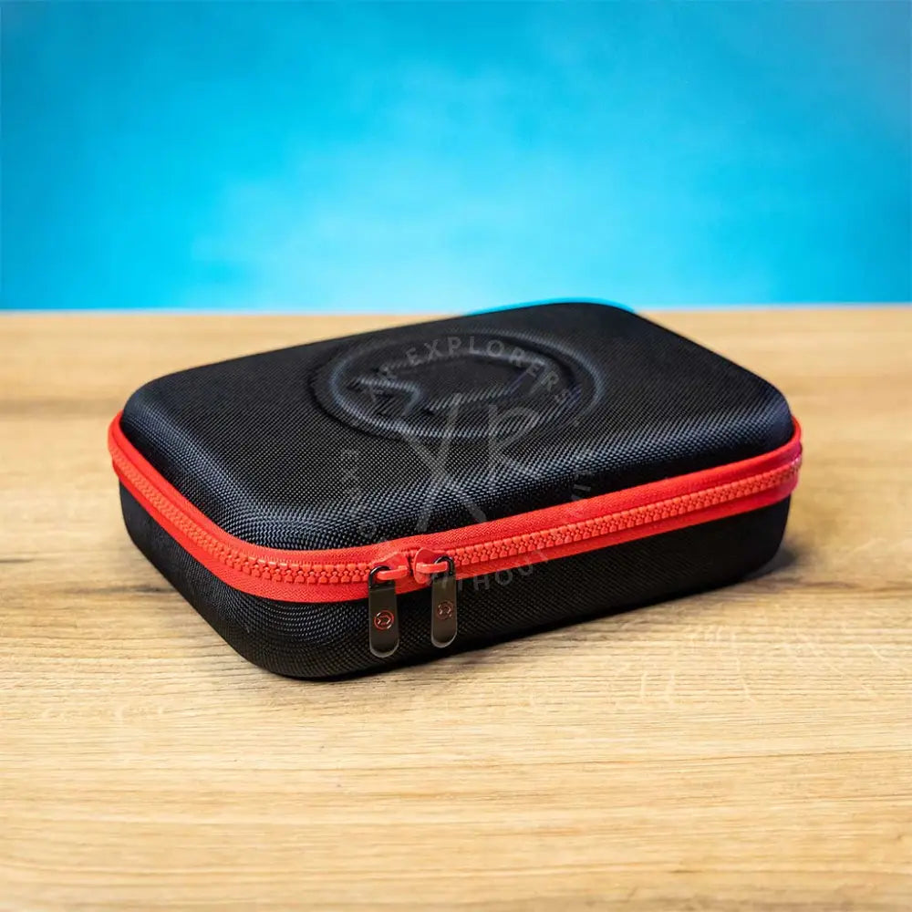 A semi-hard zipper case with a black body and red detailing, designed for storing the Divesoft Analyzer He/O₂.