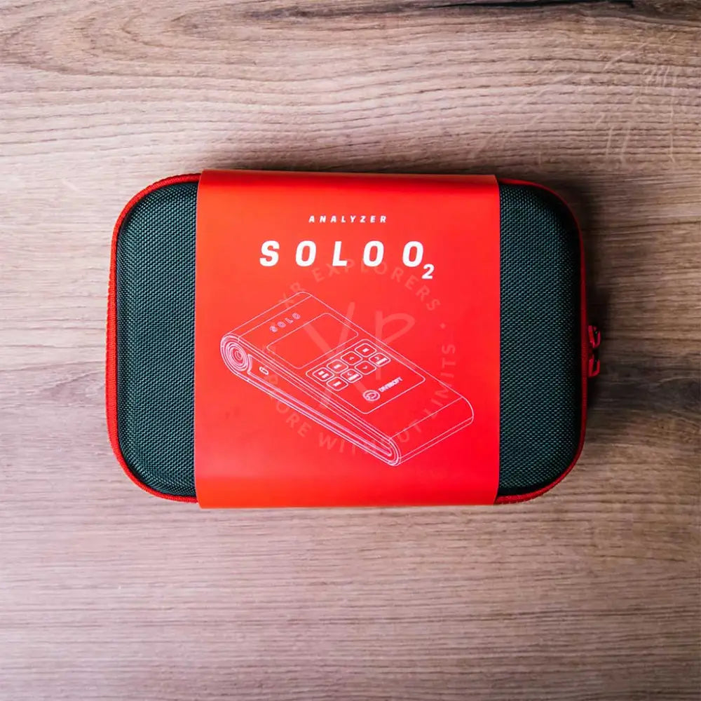 Divesoft SOLO O2 analyzer packaged in a semi-hard case with red and black colors featuring the product name and an image of the device on the label.