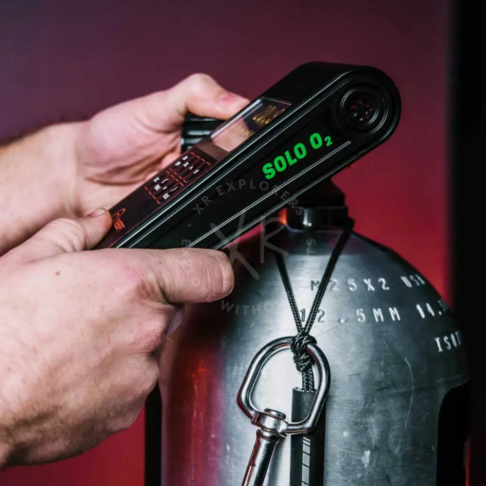Black solo o2 nitrox analyzer with green illuminated branding and digital display for diving gas analysis