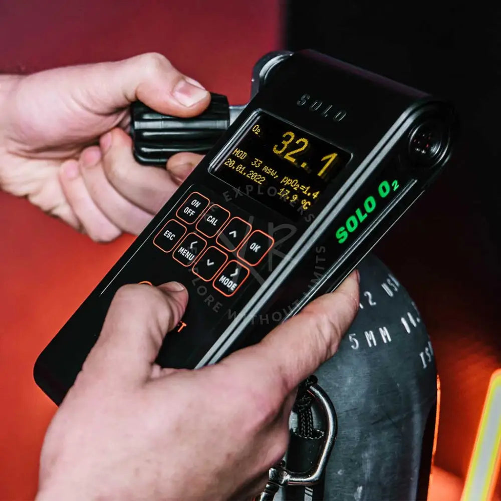Black solo o2 portable oxygen analyzer with digital display showing 32.1 percent oxygen and orange-lit buttons by divesoft