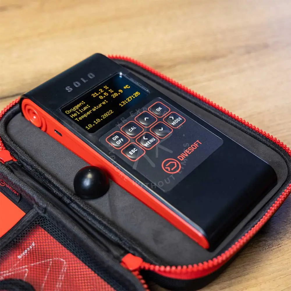 Black and red divesoft analyzer solo trimix analyzer with digital display showing oxygen helium and temperature readings