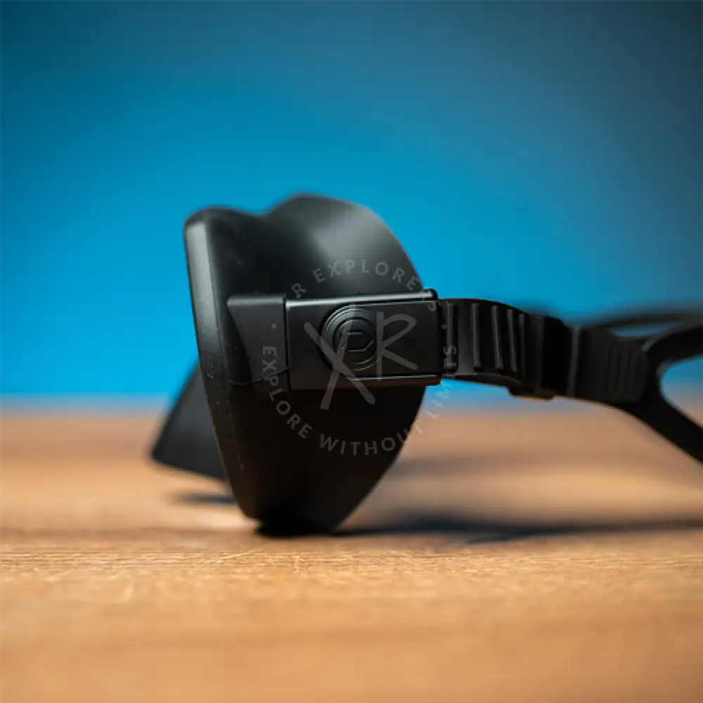 DiveSoft sentry frameless black plastic diving mask with textured neoprene strap and circular logo on the frame
