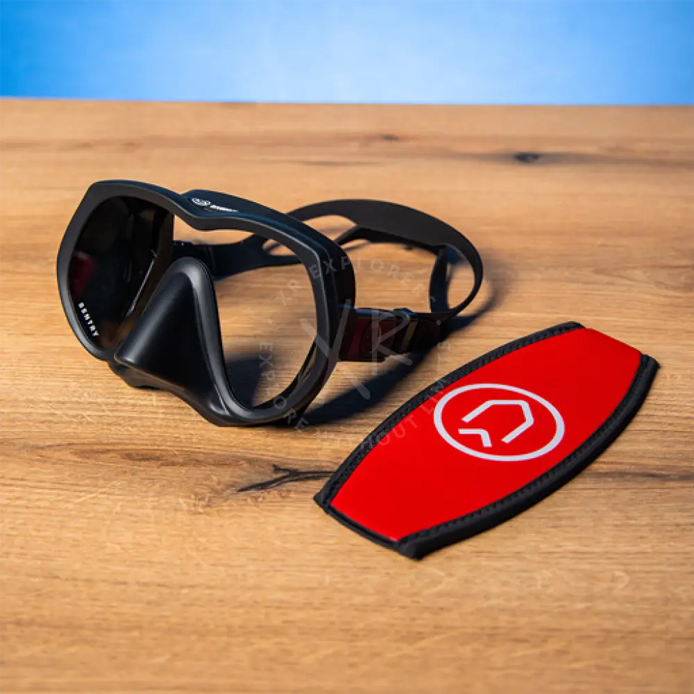 Black divesoft sentry frameless diving mask with red neoprene strap and white logo on side panel
