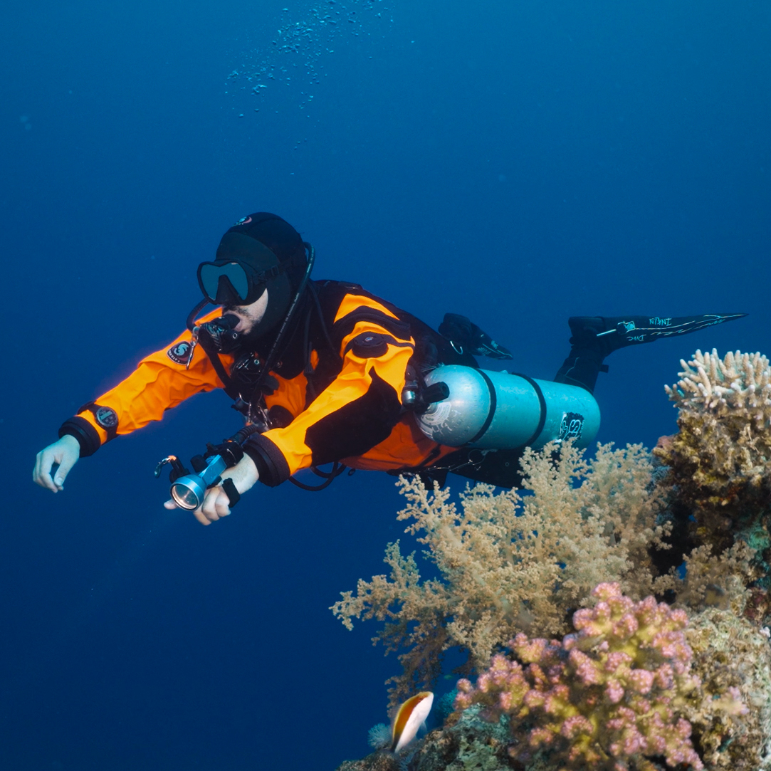 Drysuit diver practicing neutral buoyancy and trim control in Saudi Arabia KSA winter
