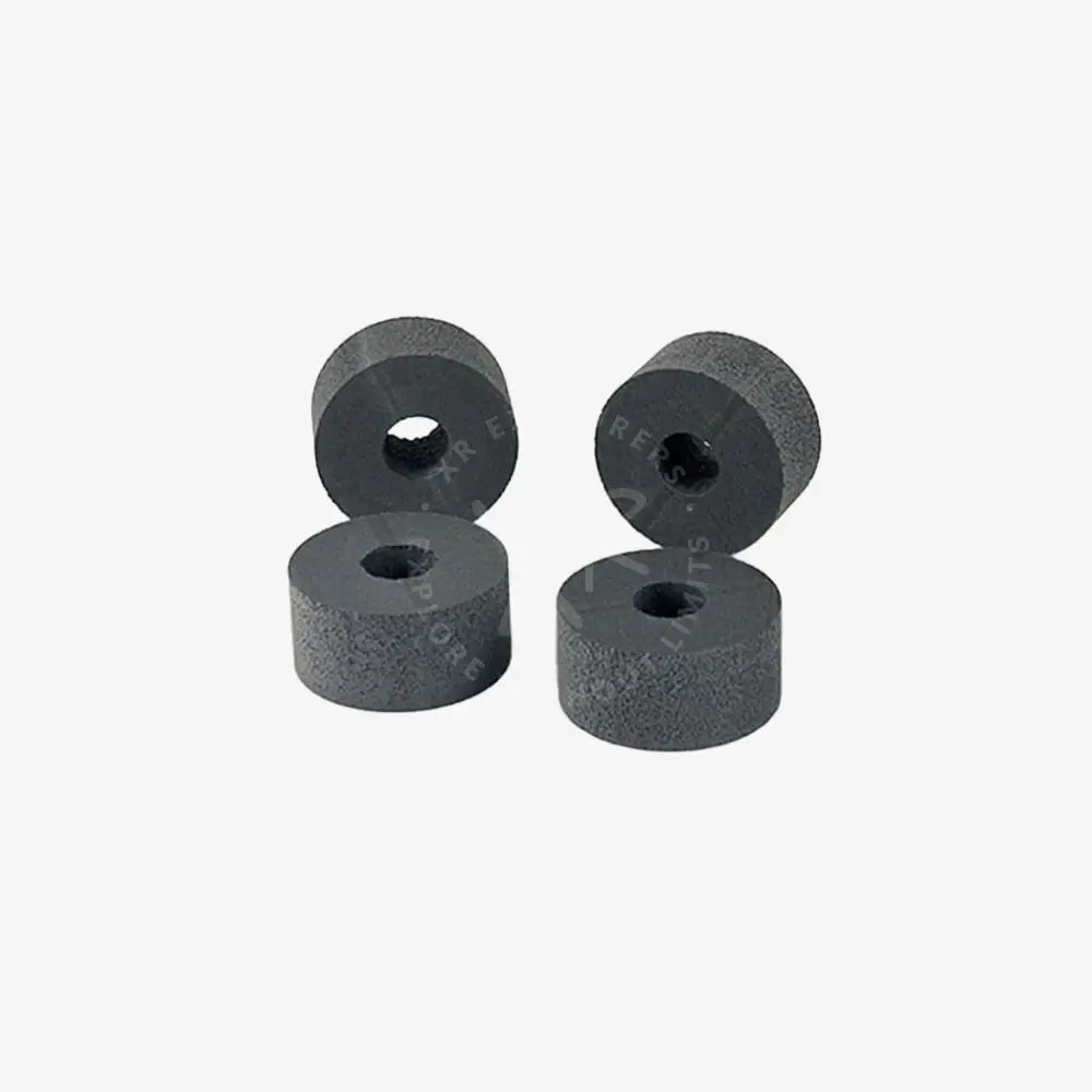 Four dark gray cylindrical foam pads with textured surface and central holes for floating ring 125g