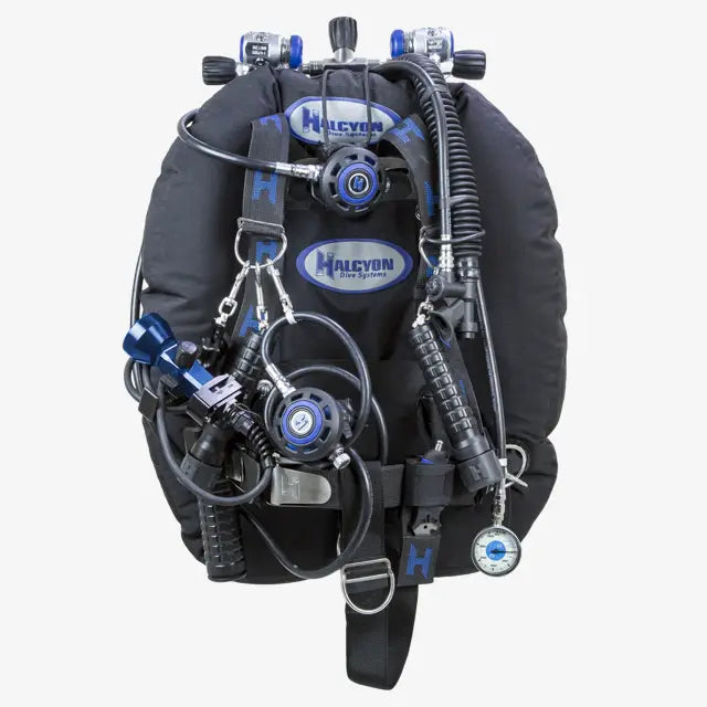 Black halcyon dive buoyancy compensator with blue accents and multiple gauges for full DIR gear setup