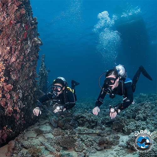 GUE instructor guiding a student in proper horizontal trim during discover diving session in Kuwait