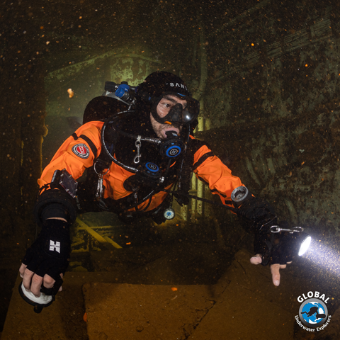 GUE Drysuit Primer student demonstrating perfect horizontal trim in a drysuit in wreck