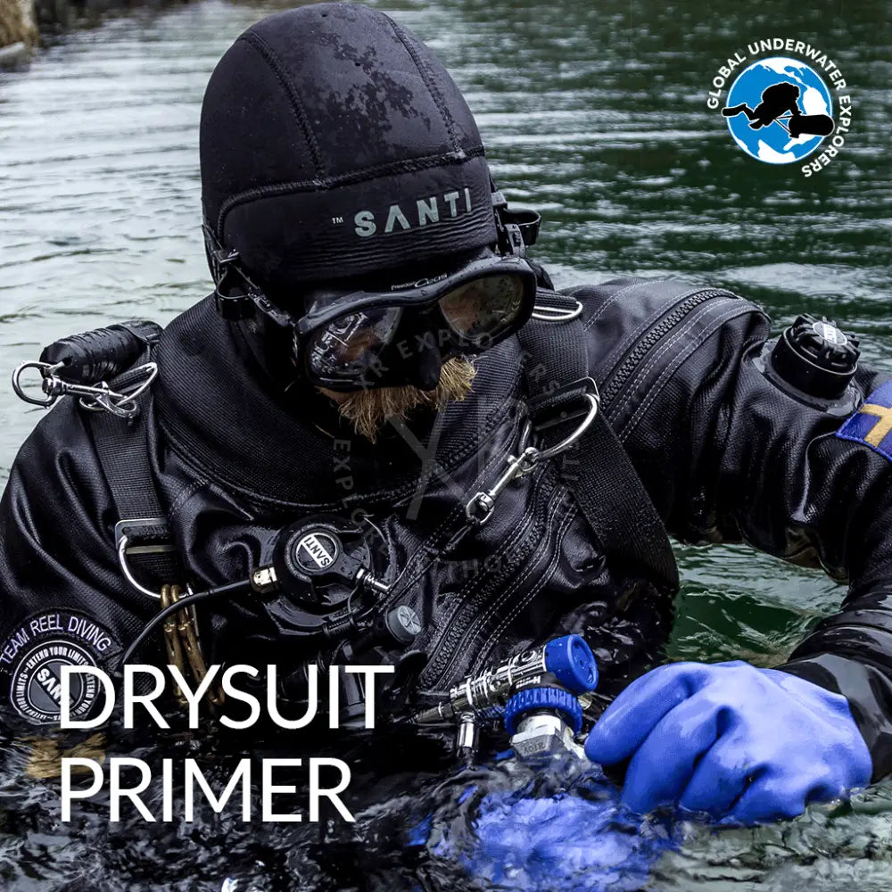 Black santi drysuit primer with blue gloves and diving gear for GUE drysuit maintenance and preparation