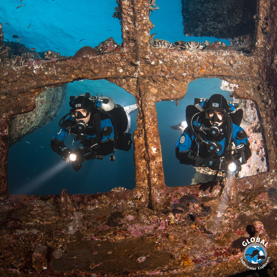 GUE Fundamentals divers practicing precise neutral buoyancy and trim in ship wreck in the red sea