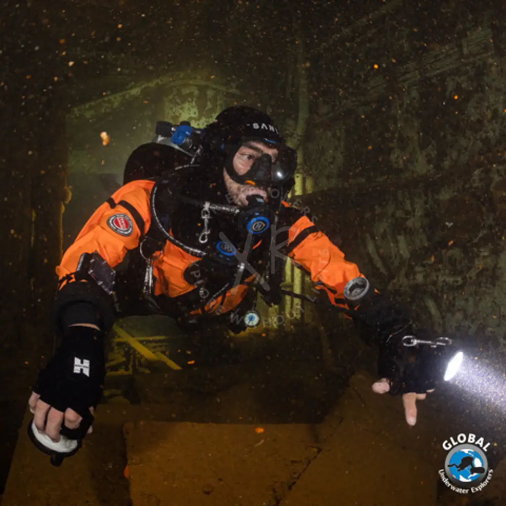 GUE Drysuit Primer student demonstrating perfect horizontal trim in a drysuit in wreck