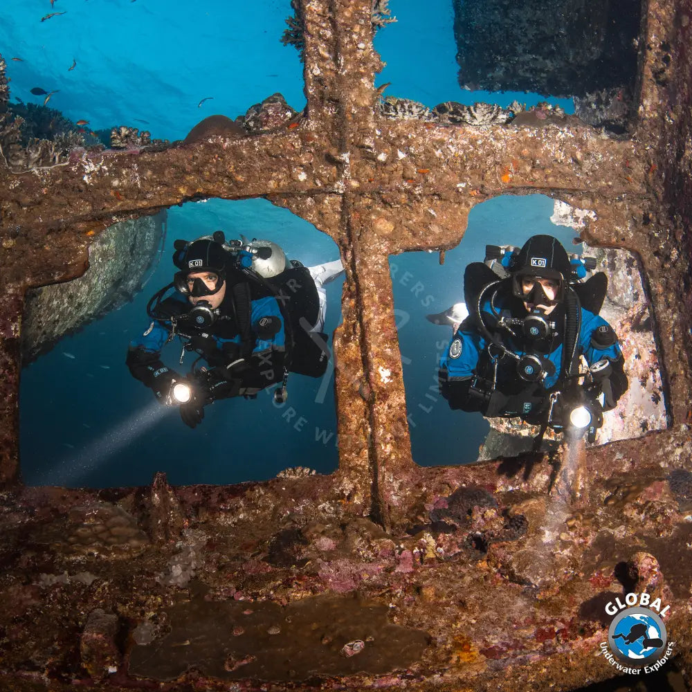 GUE Fundamentals divers practicing precise neutral buoyancy and trim in ship wreck in the red sea