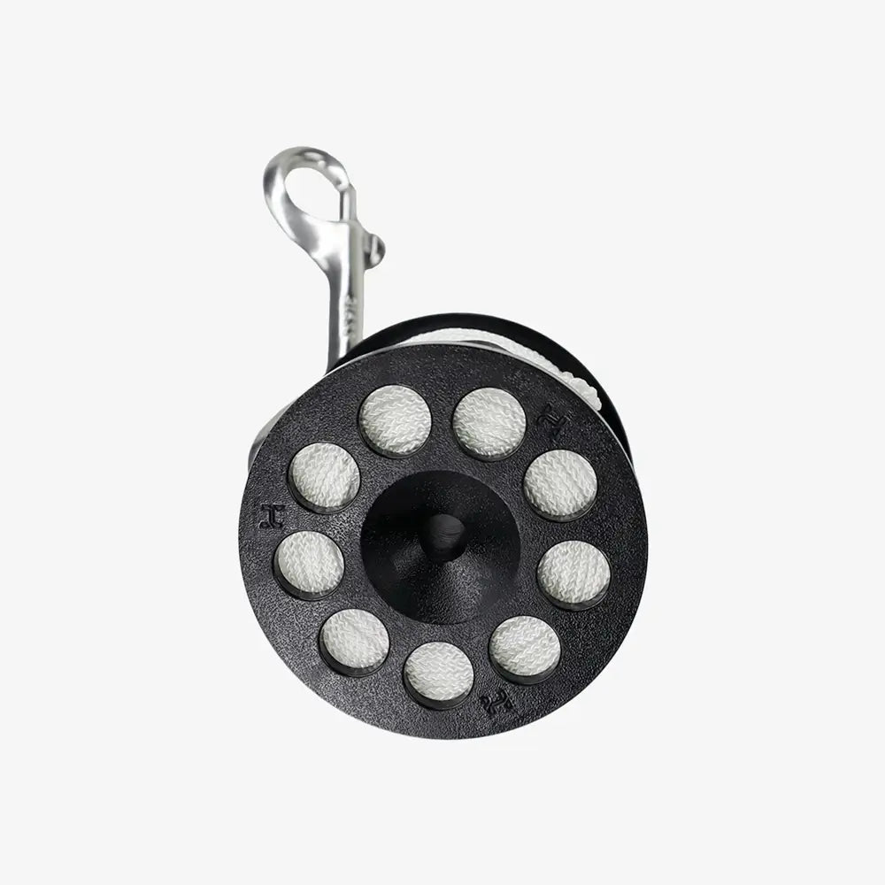 Black metal reel with silver clip on a white background