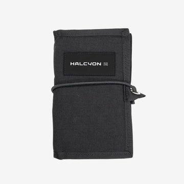 Black wallet with 'HALCYON' branding on a white background
