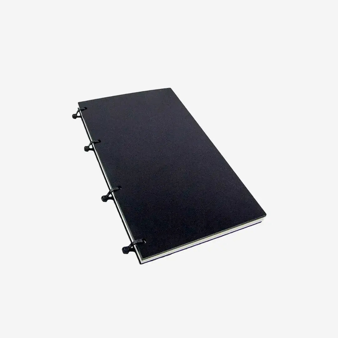 Black notebook with ring binding on a white background