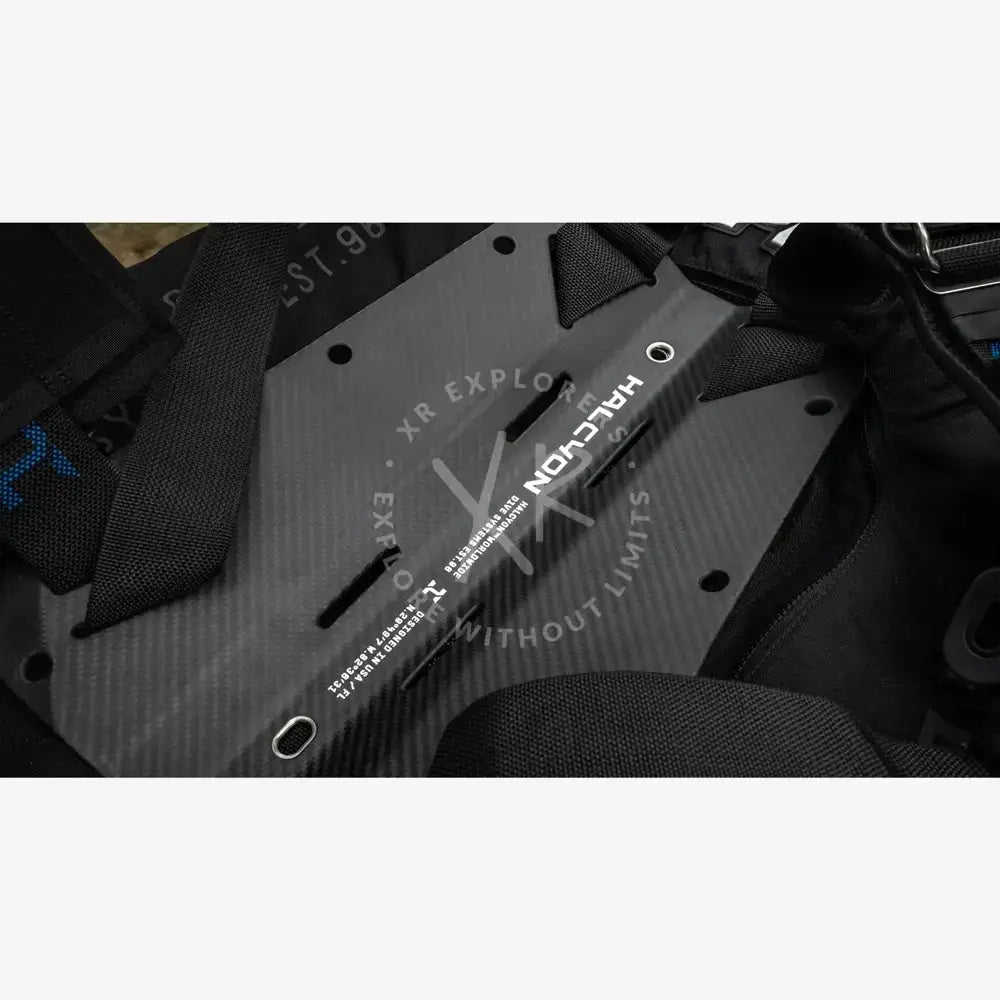 Black carbon fiber halcyon racing harness plate with white branding and mounting holes for halcyon era pro bc system
