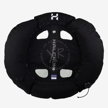 Black halcyon inflatable tire snow tube with central strap branded halcyon and silver-toned hardware for winter fun