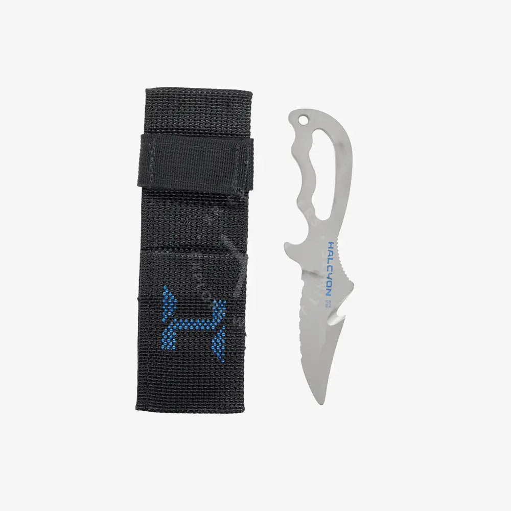 A titanium diving knife with a serrated and straight edge blade, featuring an ergonomic handle and a line cutter. The knife is accompanied by a sheath, and the blade is marked with a Halcyon logo.