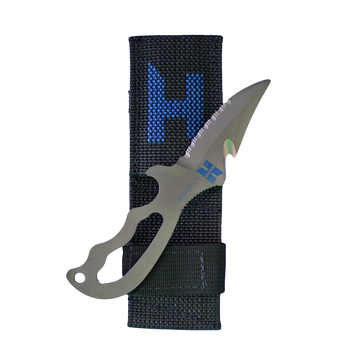 A titanium diving knife with a serrated and straight edge blade, featuring an ergonomic handle and a line cutter. The knife is accompanied by a sheath, and the blade is marked with a Halcyon logo.