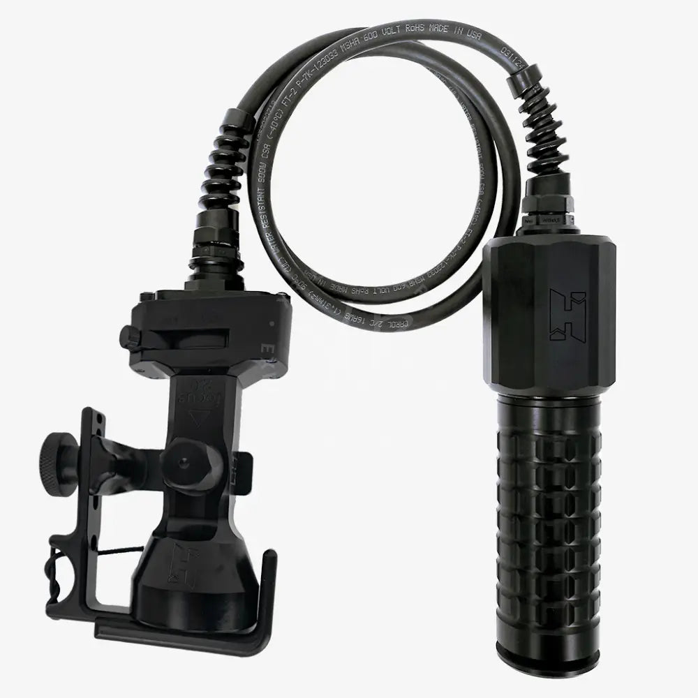 Black Halcyon Focus 2.0 tactical flashlight with textured grip and coiled cable for durable hands-on use