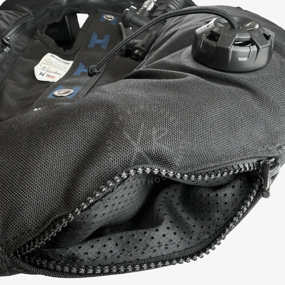 Black textured fabric halcyon legend mk2 deluxe double cylinder bc system diving vest with black inflation valve and blue logo accents