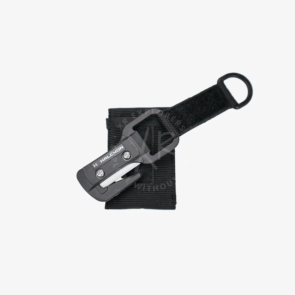 Black halcyon line cutter multi-tool with sleek compact design and integrated strap for easy attachment