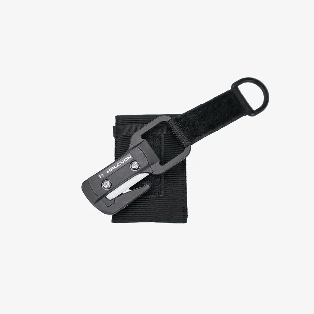 Black halcyon line cutter multi-tool with sleek compact design and integrated strap for easy attachment