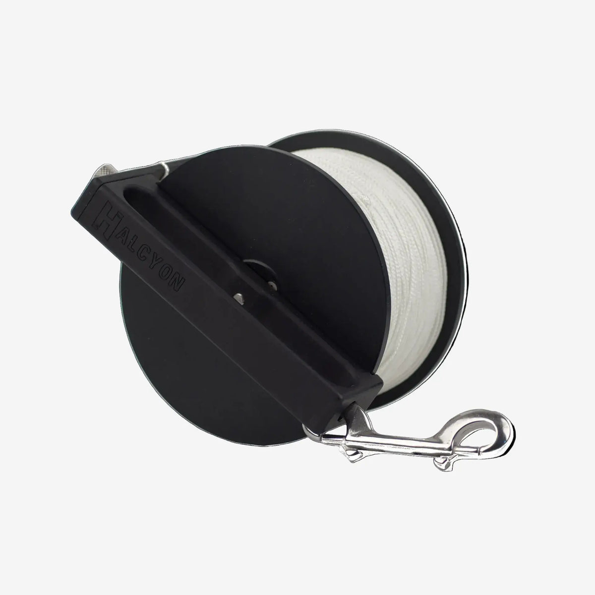 Black reel with white line and metal clip on a white background