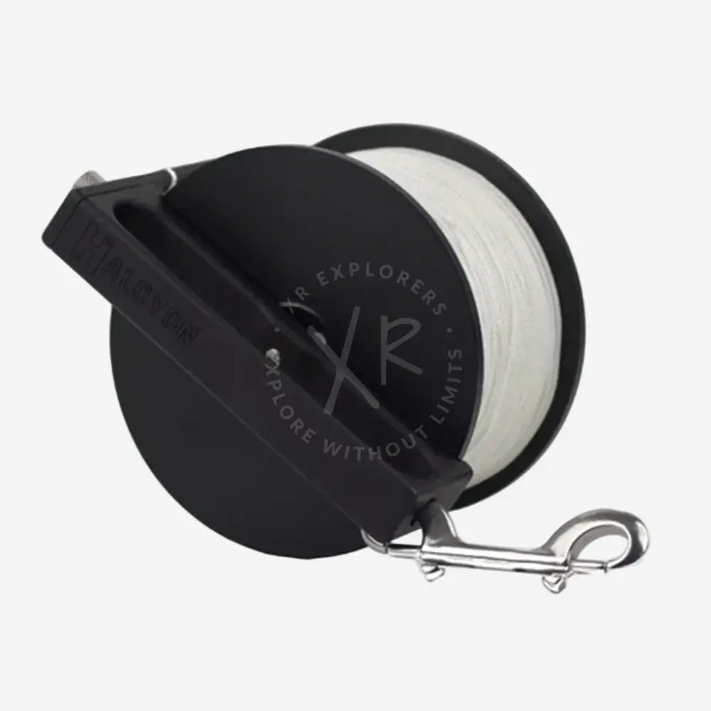 A black and silver Pathfinder primary reel with a white spool of line, designed for diving and underwater exploration.