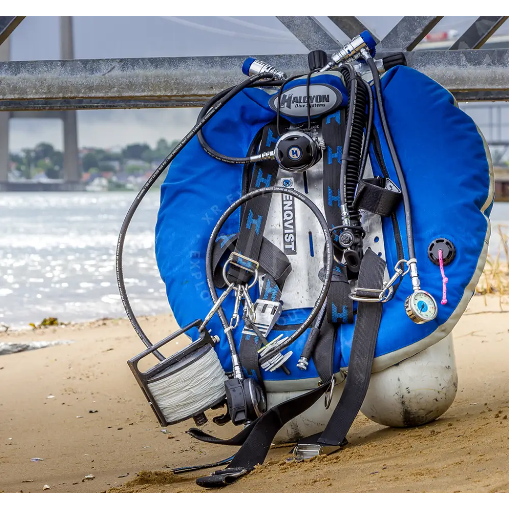 Blue halcyon dive buoyancy compensator with black straps and silver hardware shown on the back side for diving use
