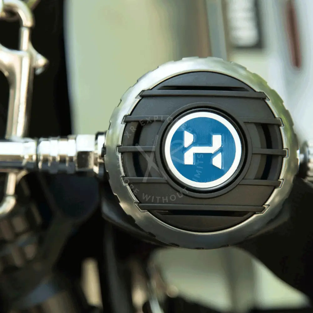 Black and silver motorcycle headlight with blue circular logo featuring white h for halcyon sidemount regulator package h-75p halo