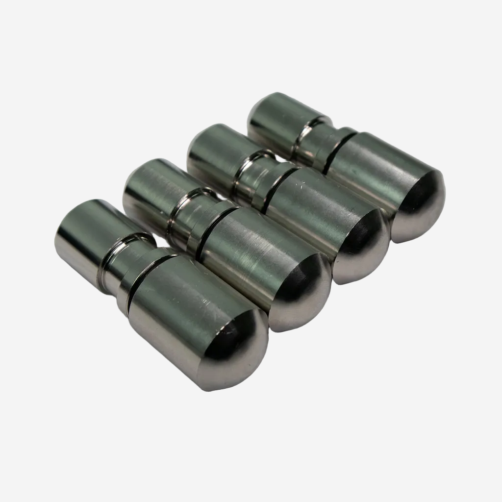 A set of four silver-colored metal weights with O-rings, arranged side by side.