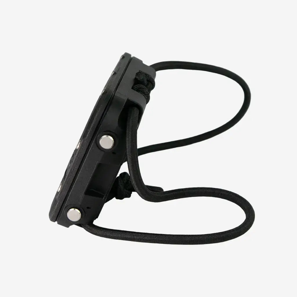 Black plastic wrist-mounted halcyon symbios bundle device with black elastic strap and silver buttons for hands-free use