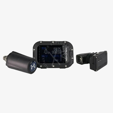 A modern Halcyon Symbios handset with a digital display showing dive information, featuring a black casing with blue accents.