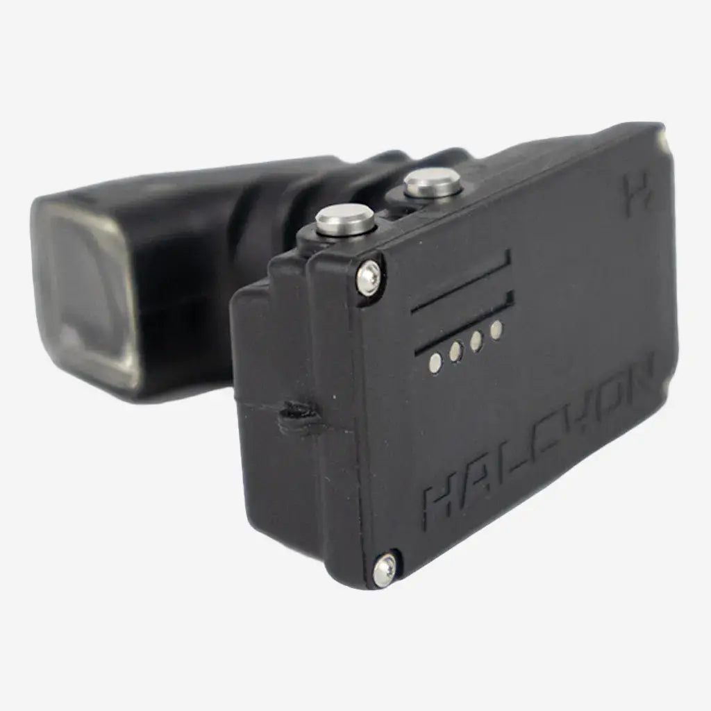 A black Halcyon Symbios Head-up Display for diving, featuring a micro display and control buttons.