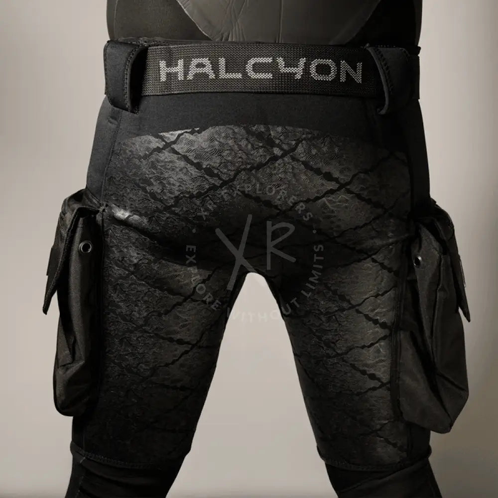 Black tactical pants with a visible brand logo on a neutral background