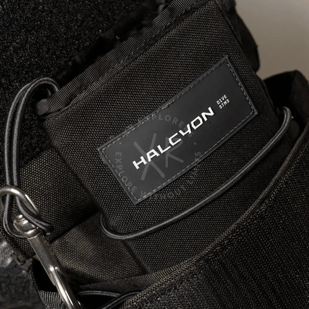 Black tactical shorts with multiple pockets and a belt on a white background