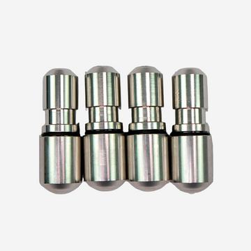 A set of four silver-colored metal weights with O-rings, arranged side by side.