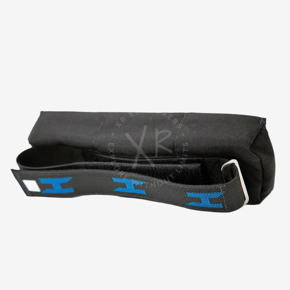 A black spine weight pouch with velcro closures and a blue logo, designed to fit onto diving equipment.
