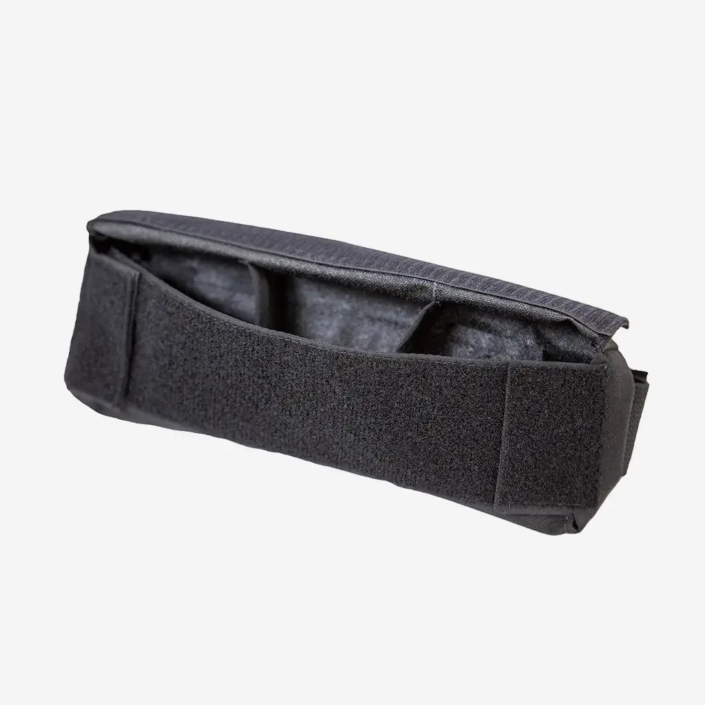 A black spine weight pouch with velcro closures and a blue logo, designed to fit onto diving equipment.