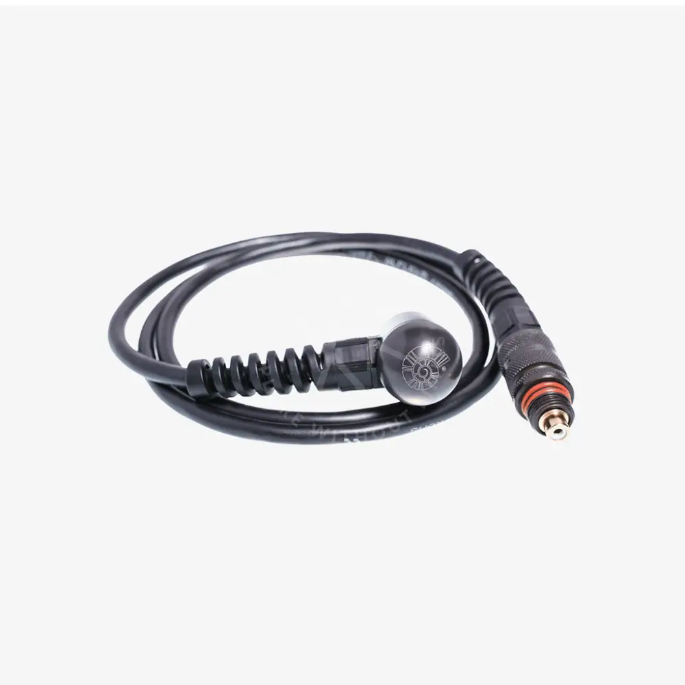 Coiled black cable with a metal connector on a white background